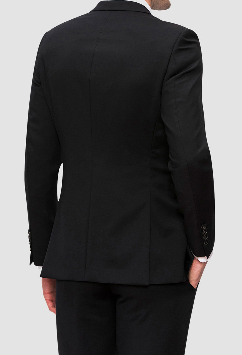 a reverse view of the Joe black anchor suit jacket in black pure wool styled with the razor trouser and a white shirt FJV032