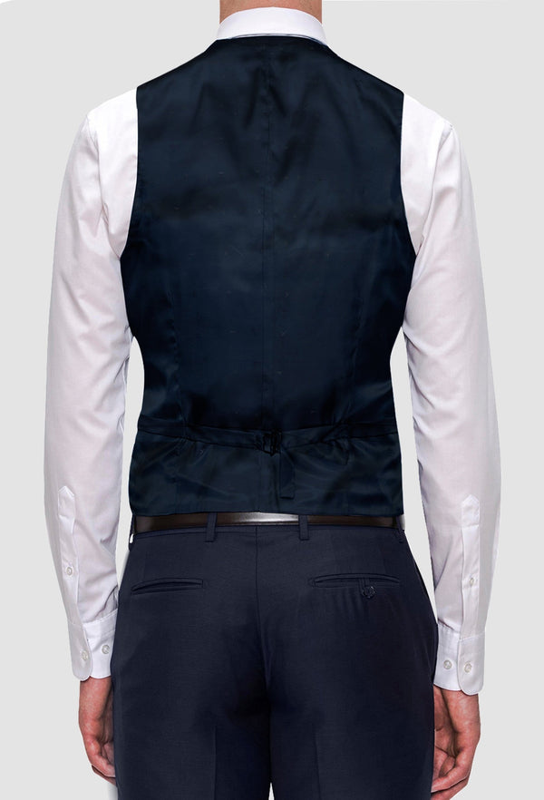 a rear view of the Joe Black slim fit mail vest in navy pure wool FJV032 layered over a white shirt