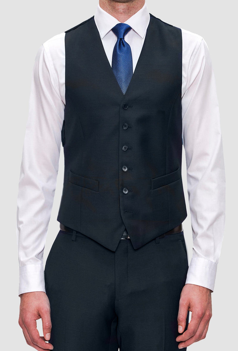 A frontal view of the Joe Black slim fit mail vest in navy pure wool FJV032 layered over a white shirt and blue tie