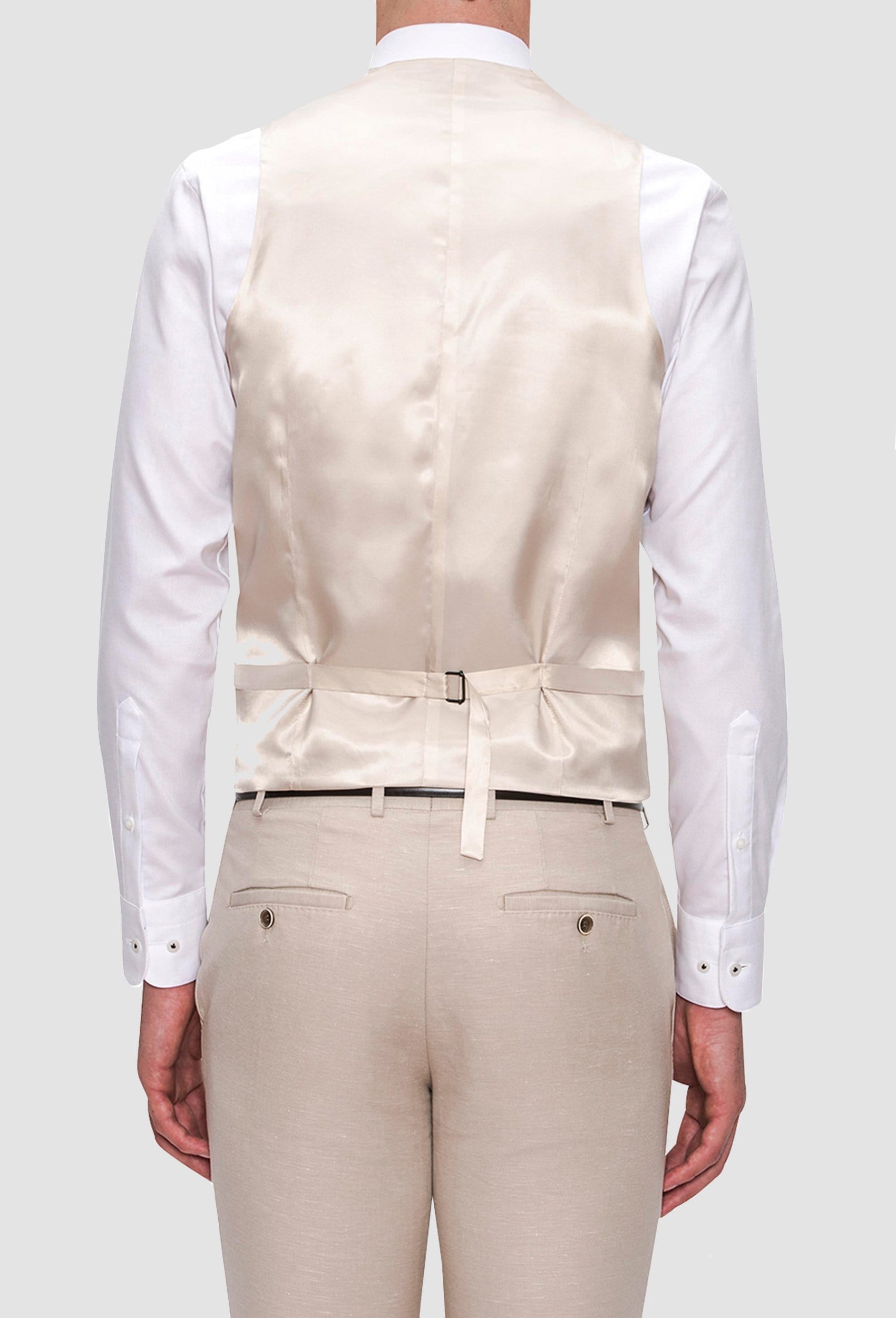 the reverse detail on the Joe Black slim fit mail vest in sand linen blend layered over a white shirt
