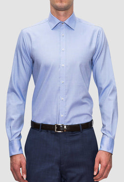 A front view of a model wearing the Joe Black slim fit pioneer shirt in sky blue cotton FCE256 with a navy trouser