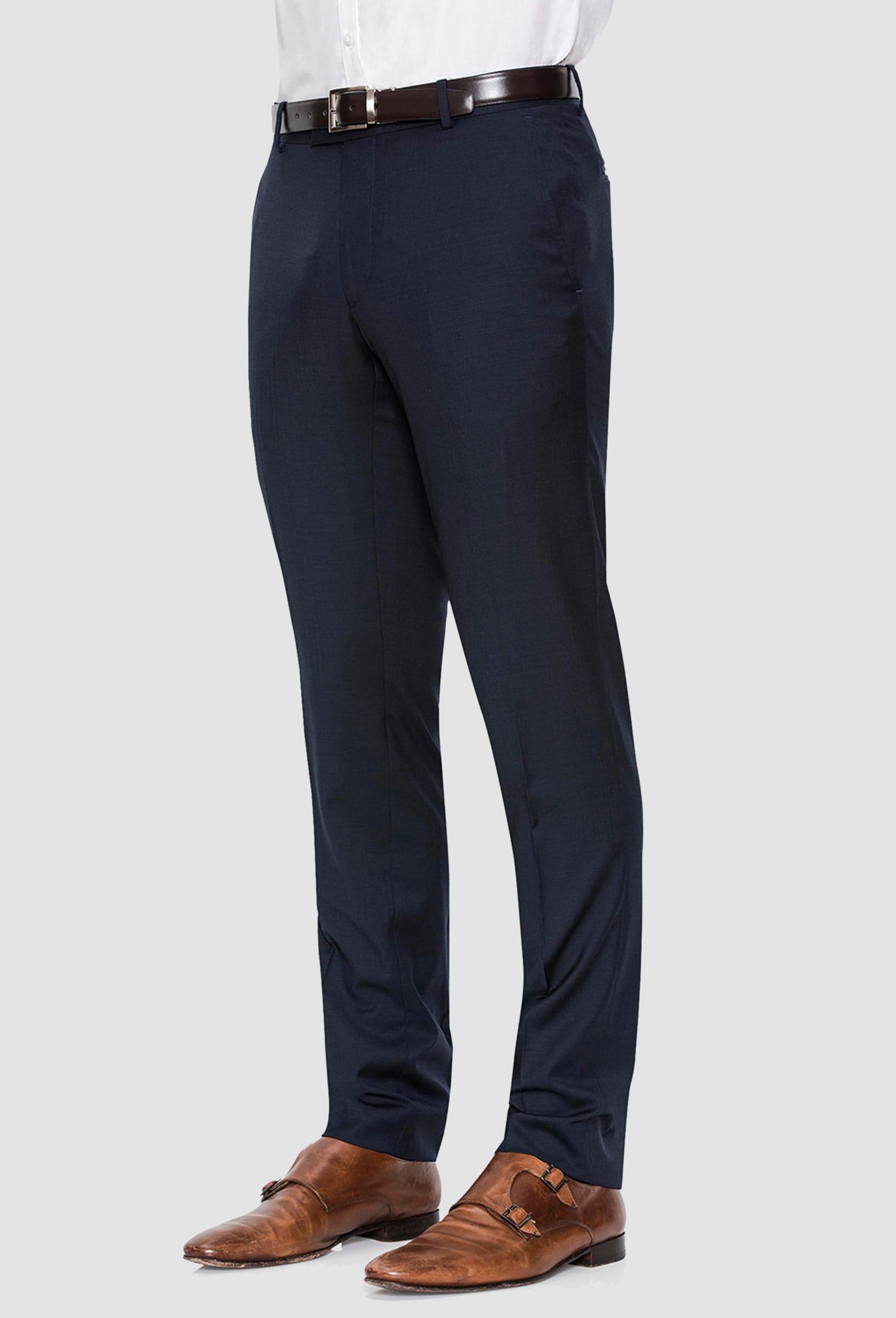a side view of a model wearing the Joe Black slim fit razor trouser in navy pure wool