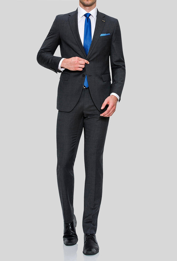 a full length view of a model wearing the Joe Black slim fit sergeant suit in charcoal pure wool FJD899