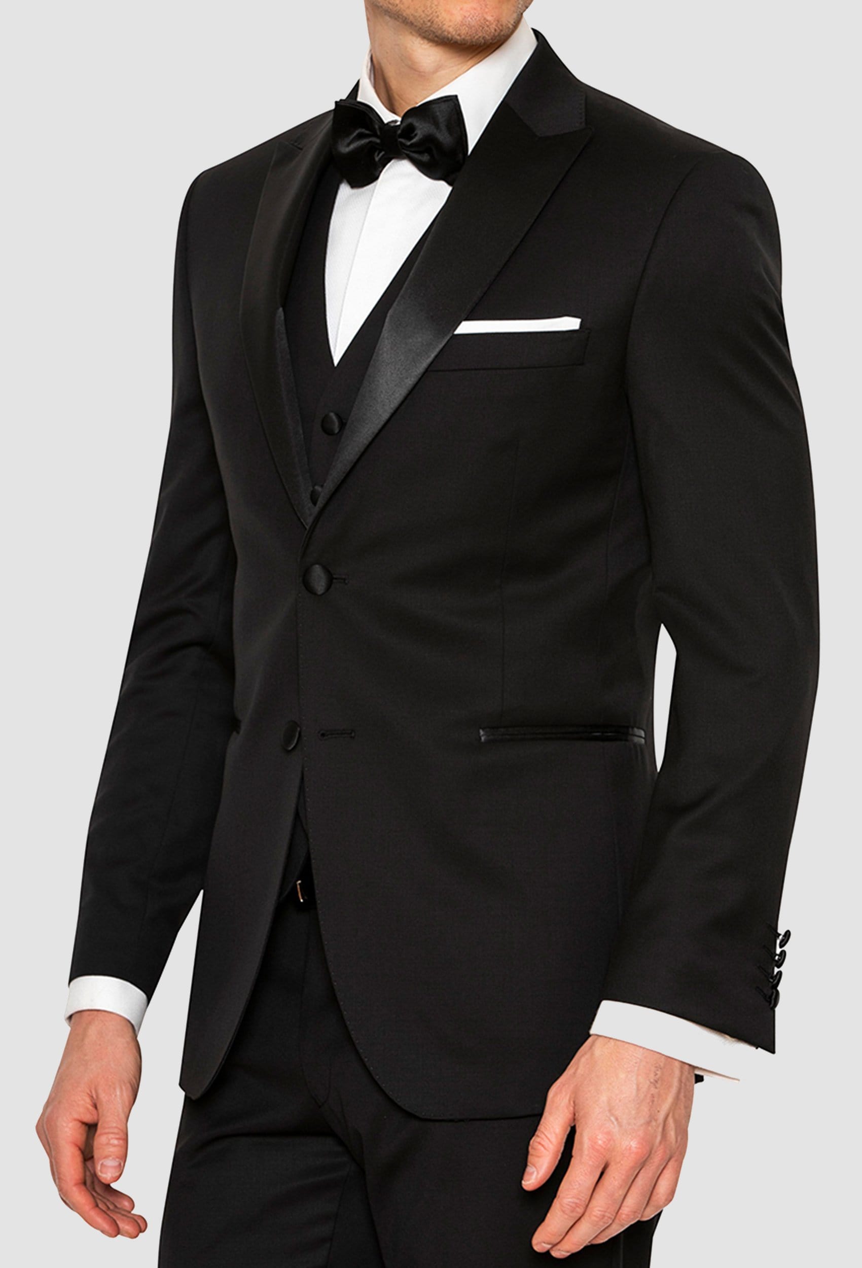 A side view of the Joe Black slim fit sloane evening suit jacket in black pure wool including the satin peak lapel detail F6447