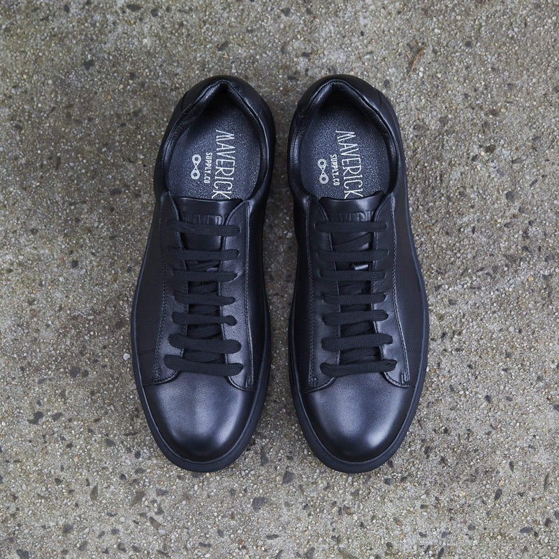 a pair of black mens leather shoes