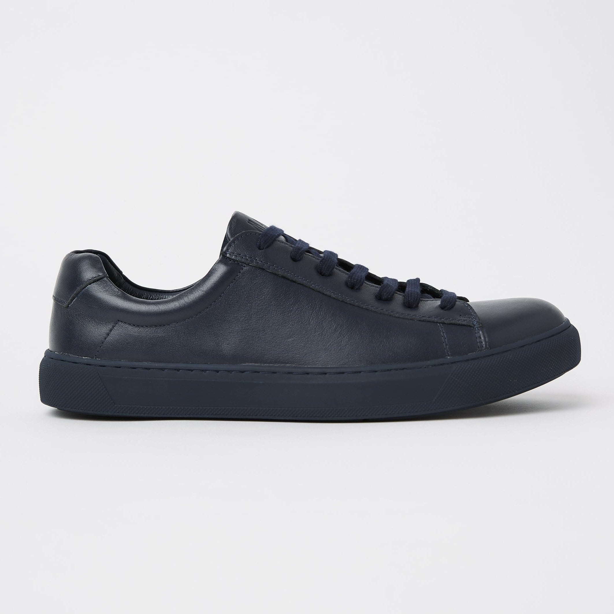 mavericks cooper mens leather sneaker in navy blue facing the side