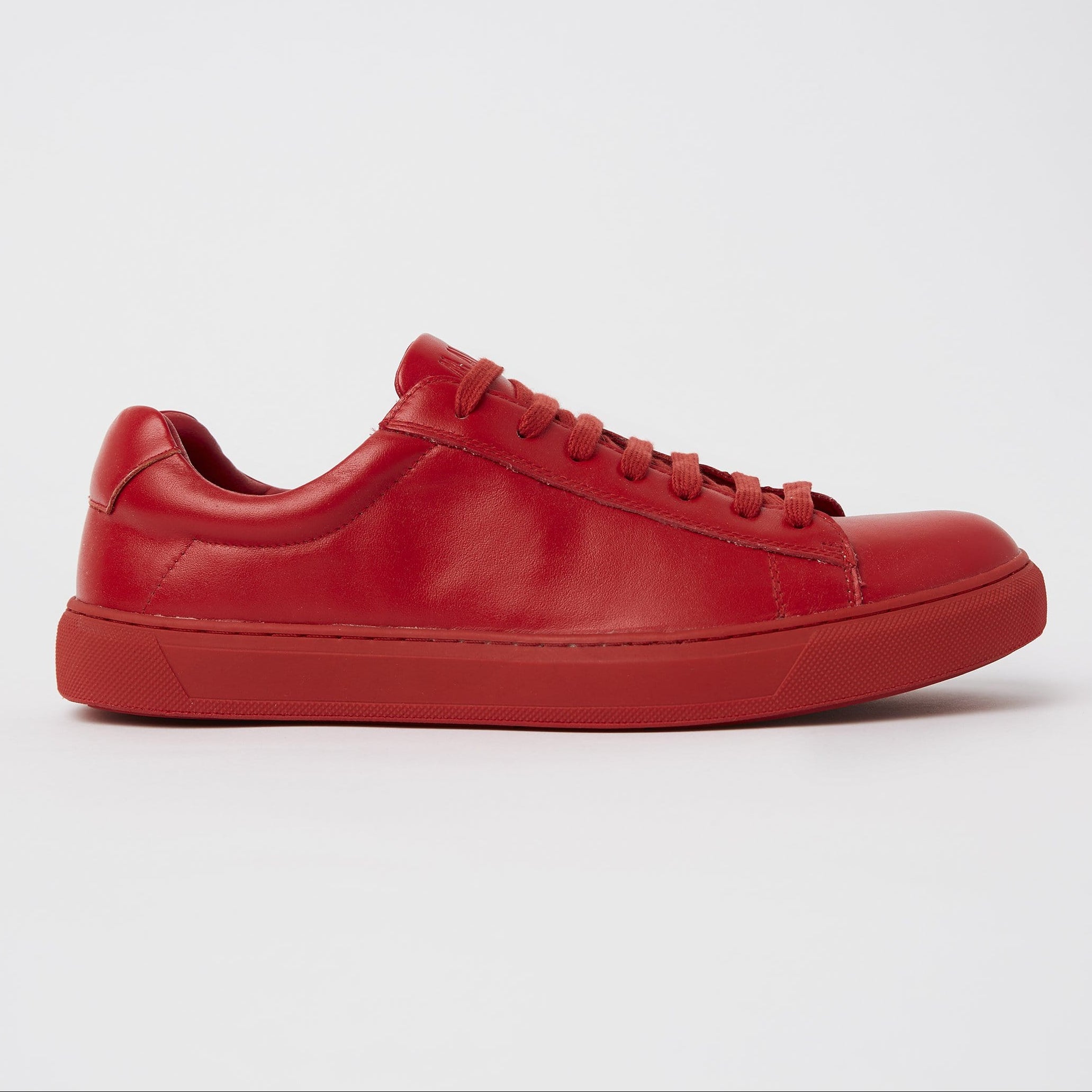 the mavericks cooper red sneaker on the side showing the bright red colour and slim look design