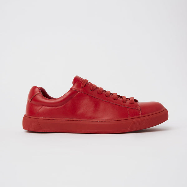 the mavericks cooper red sneaker on the side showing the bright red colour and slim look design