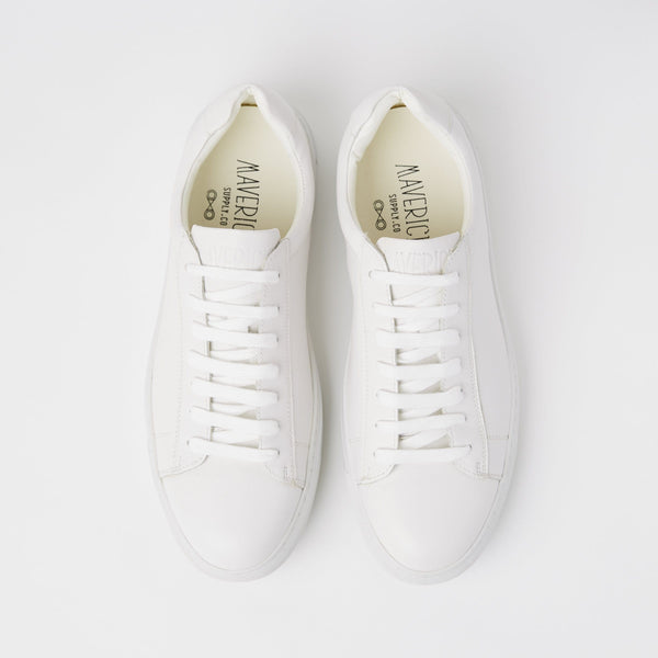 a top view of the mavericks mens white leather sneakers