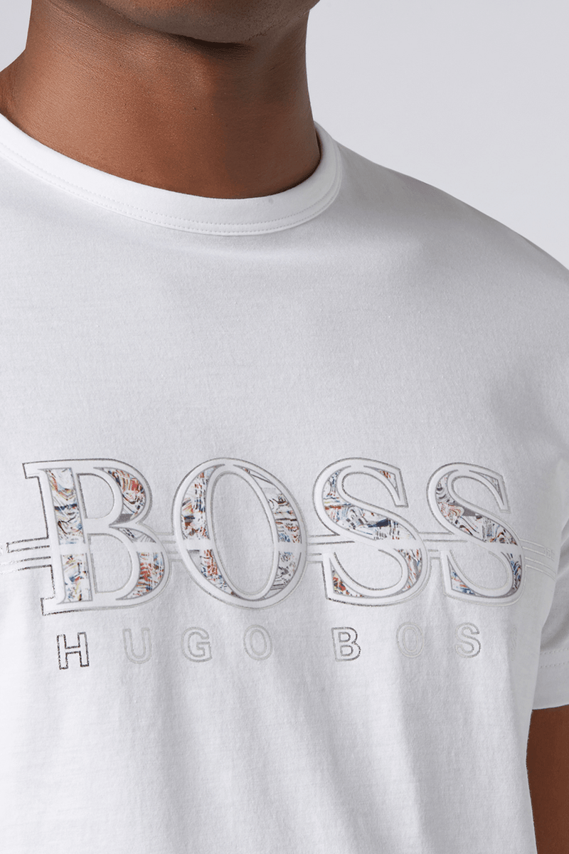 a close up of the mens t-shirt logo design on the front shows a BOSS logo with the letters filled with a colourful pattern and hugo boss written underneath