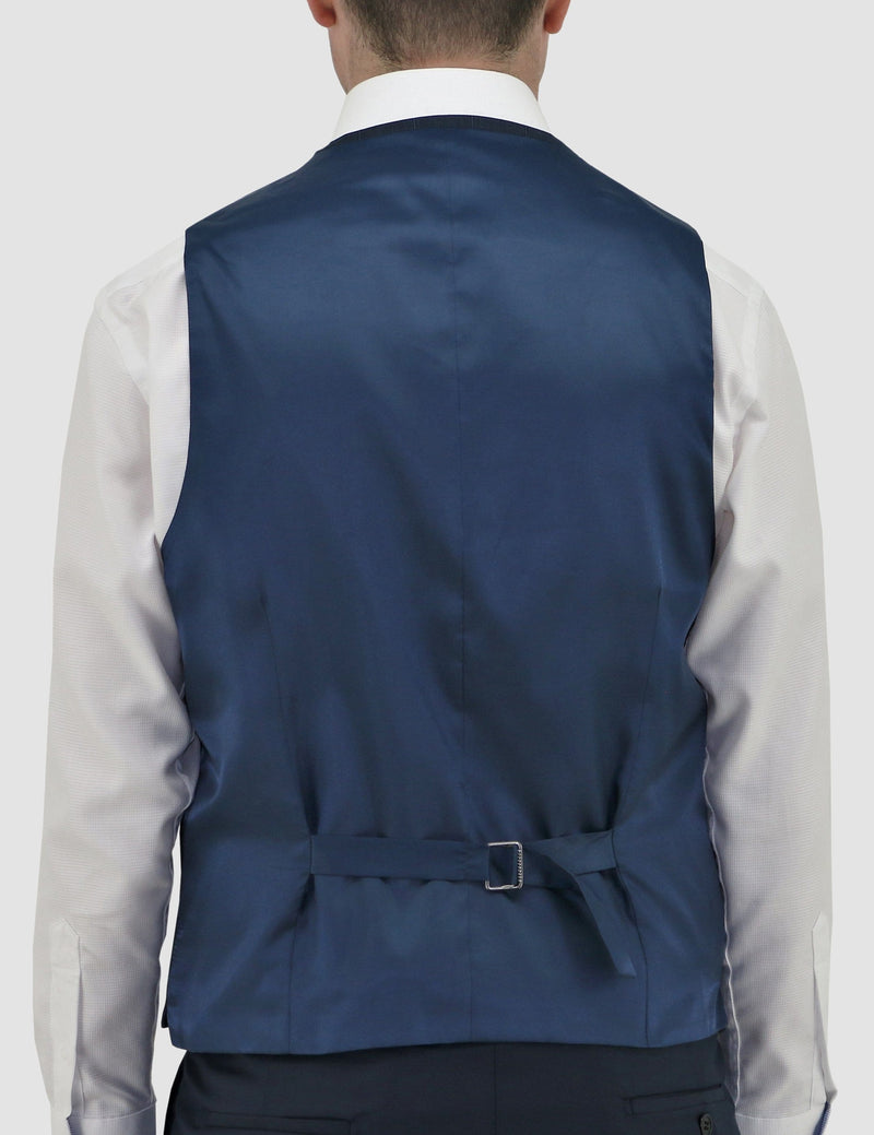 a model faces the back showing us the satin finish and tab adjuster detail on the navy blue Luke vest by Daniel Hechter, product code DH210-12