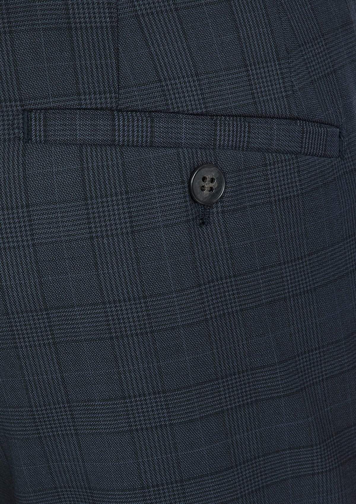 a close up fo the navy check wool fabric on the gibson slim fit caper trouser product code FG1614