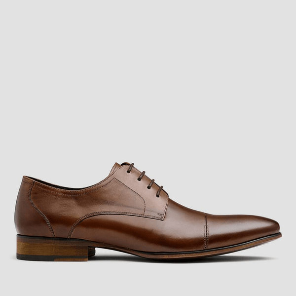 the side view of the mens capri leather dress shoe in tan 