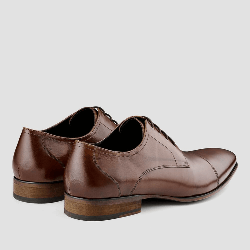 the back of the aquila mens leather shoe in tan 