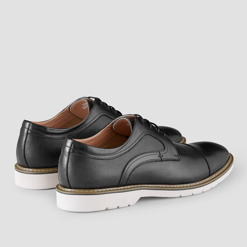 the perforated style of the mens leather dress shoe in black elather