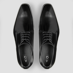 a pair of mens black leather dress shoes in a modern shape with black leather laces