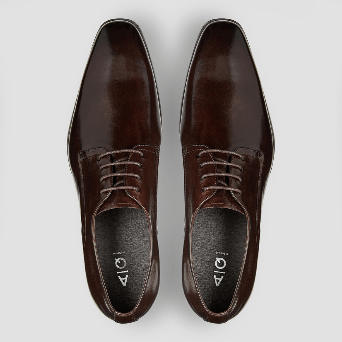 a pair of brown leather shoes from aquila in a smooth shiny finish