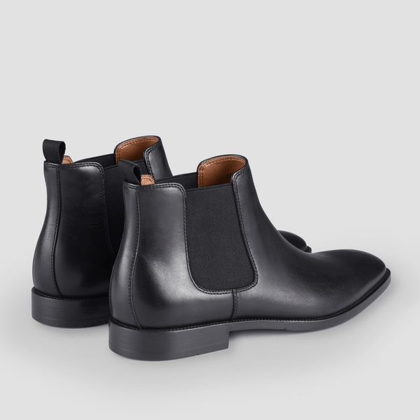 the elastic gusset and back tab show the ease involved in pulling these mens leather boots on