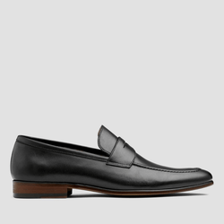 a side view showing the tab and constrast sole details of the penley mens loafer in black