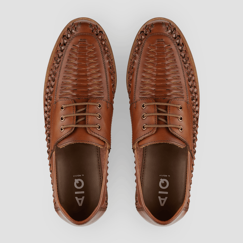 a top view of the mens casual aquila shoe in tan leather