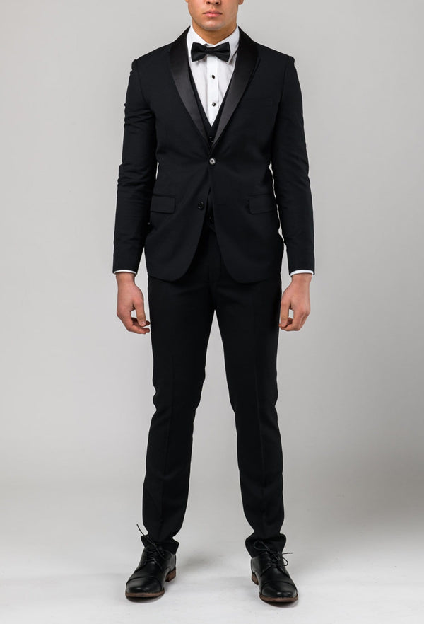 A full length view of the Aston slim fit laneport trouser in black A019301T styled within the suit