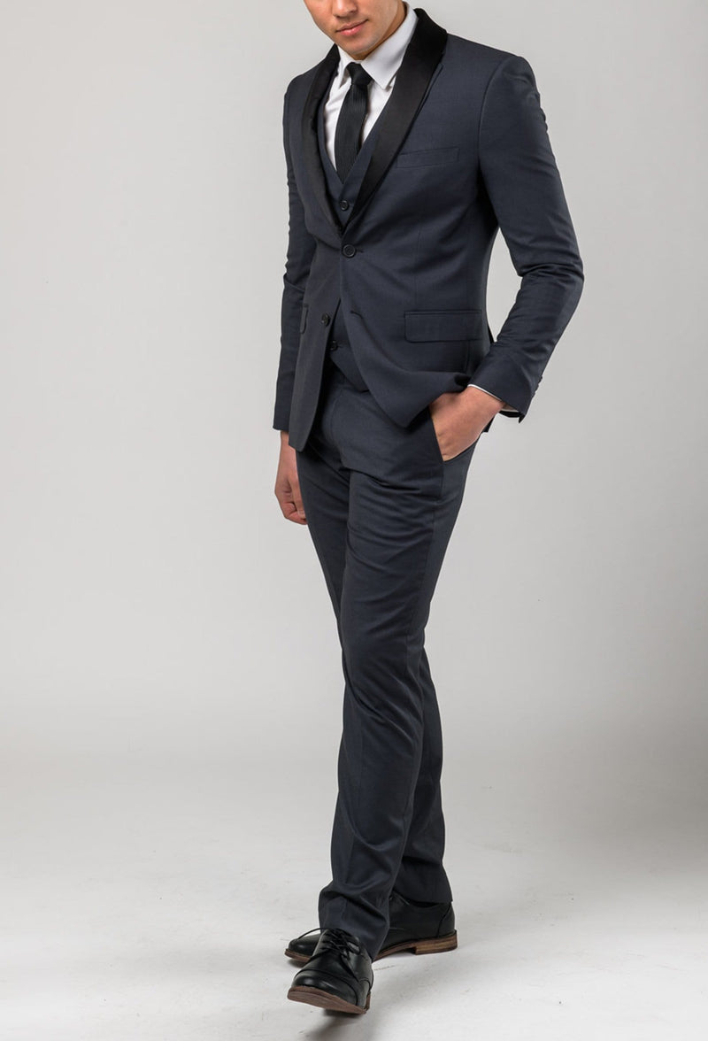 a full length view of the Aston slim fit laneport trouser in charcoal A019301T styled with the matching suit jacket
