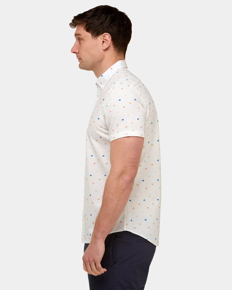 a slim fit shaped shirt in white with small palm print all over