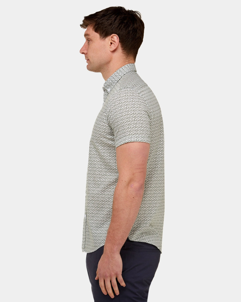 showing the slim fit of the brooksfield mens printed shirt in olive green print