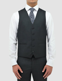 a model wears the classic fit boston ryan vest in charcoal pure wool layered over a white shirt