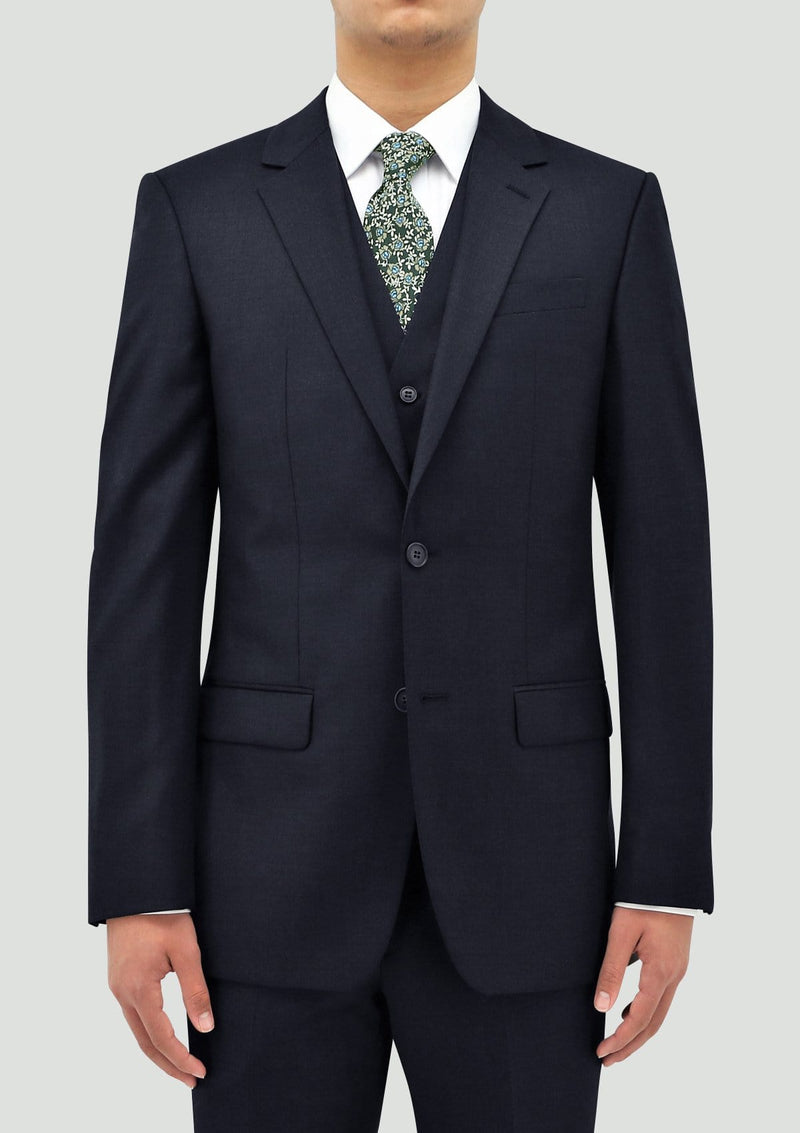 a front view of a model wearing the boston classic fit michel mens suit including the jacket and vest in navy blue wool STB106-11
