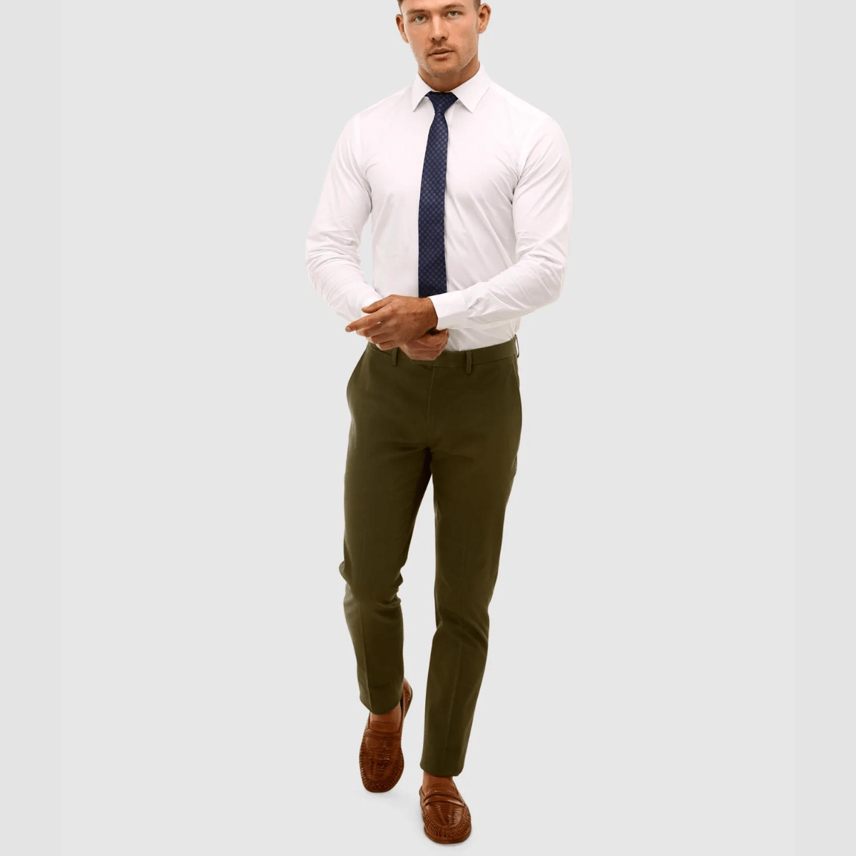 a man wears a white slim fit business shirt  by brooksfield mens shirts