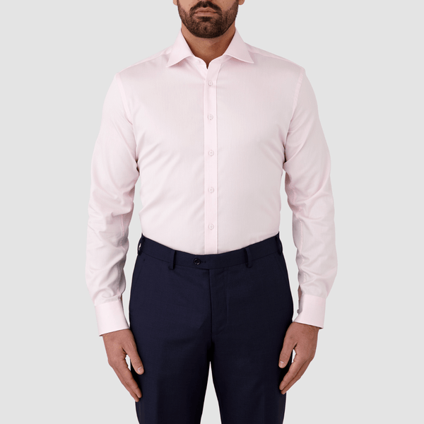 mens pink shirt with matching buttons styled with a navy suit pant