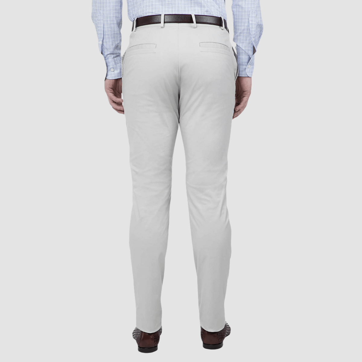 a slim fit mens light grey chino pant with brown belt and loafers