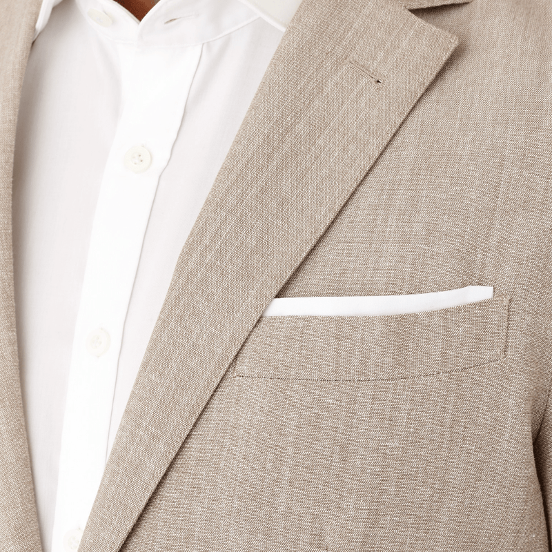 Cambridge slim fit close up of the lapel on the armadale suit in sand cotton wool blend