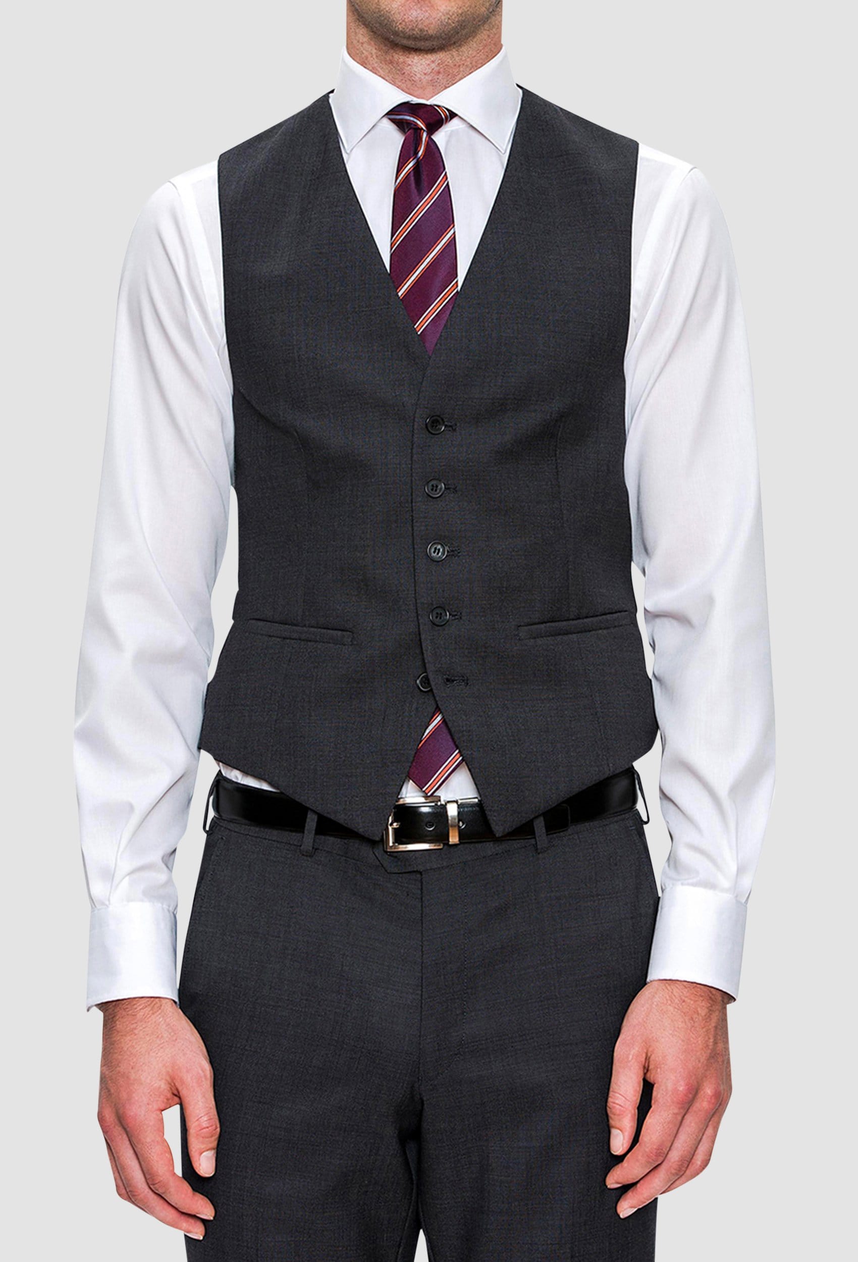 A model wears the Cambridge classic fit beaumont vest in charcoal pure wool F2800 styled with a white shirt