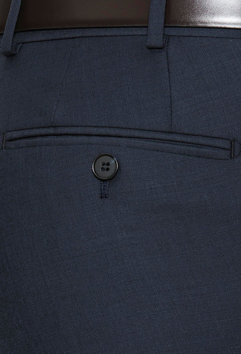 a close up view of the rear pocket detail on the cambridge jett trouser in navy F2042