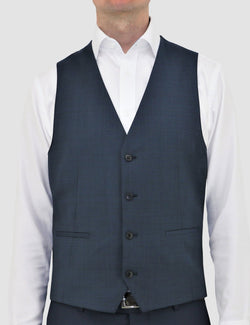 a model faces the front showing us the detail on the navy blue Luke vest by Daniel Hechter, product code DH210-12