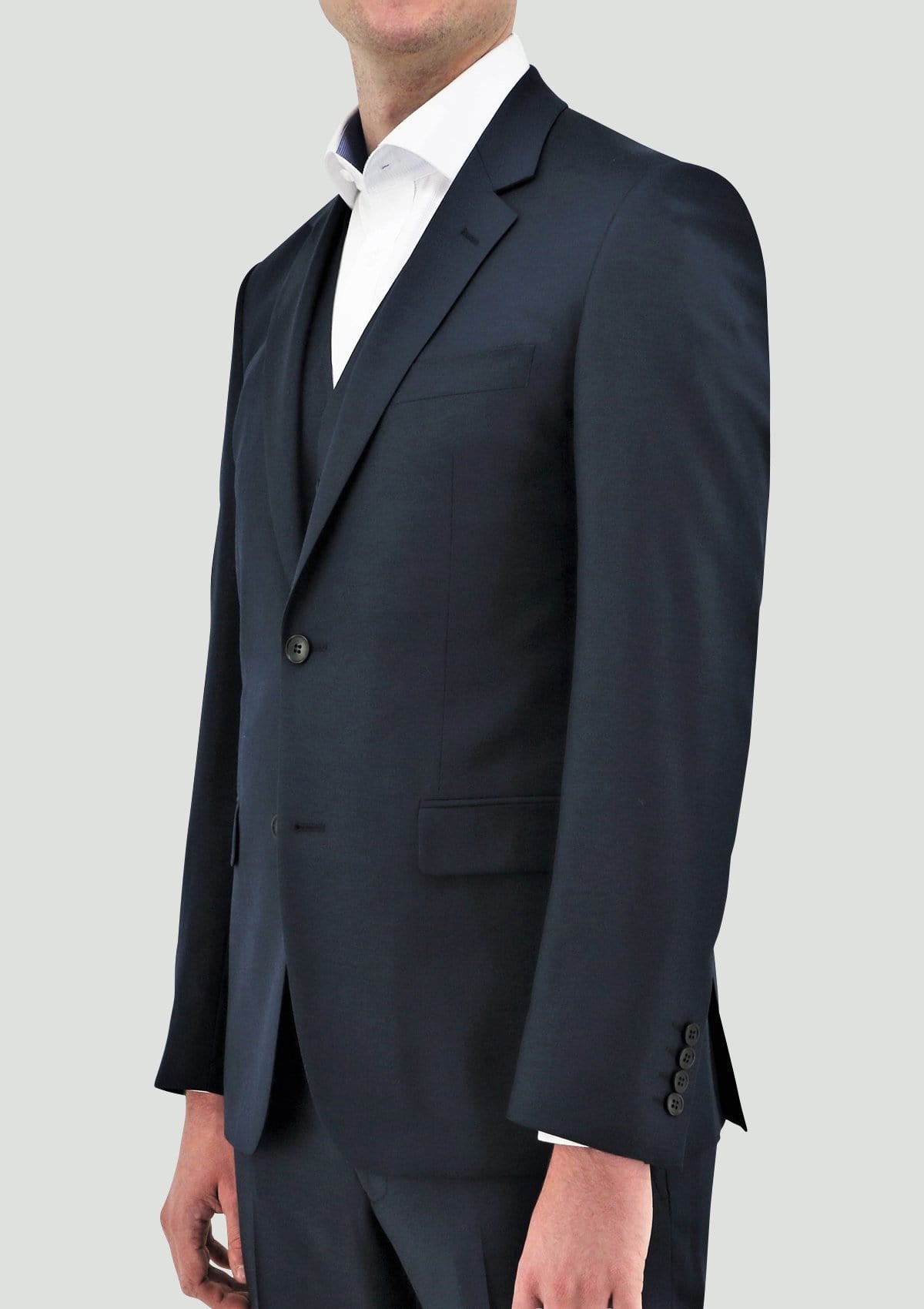 a model wears the Daniel Hechter slim fit shape suit in deep blue pure wool showing the lapel detail and deep blue colour DH106-14