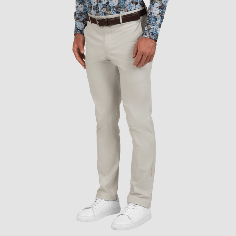 the slim fit of the mens chino pant in stone with a printed floral shirt