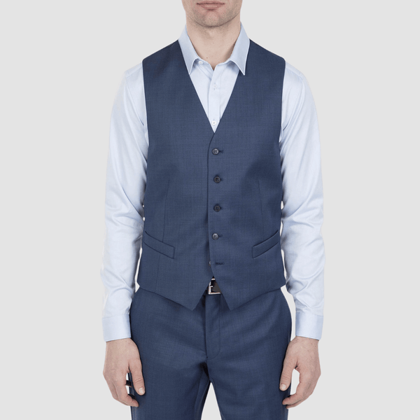 the mens mighty vest in blue over a light blue shirt and matching blue trousers
