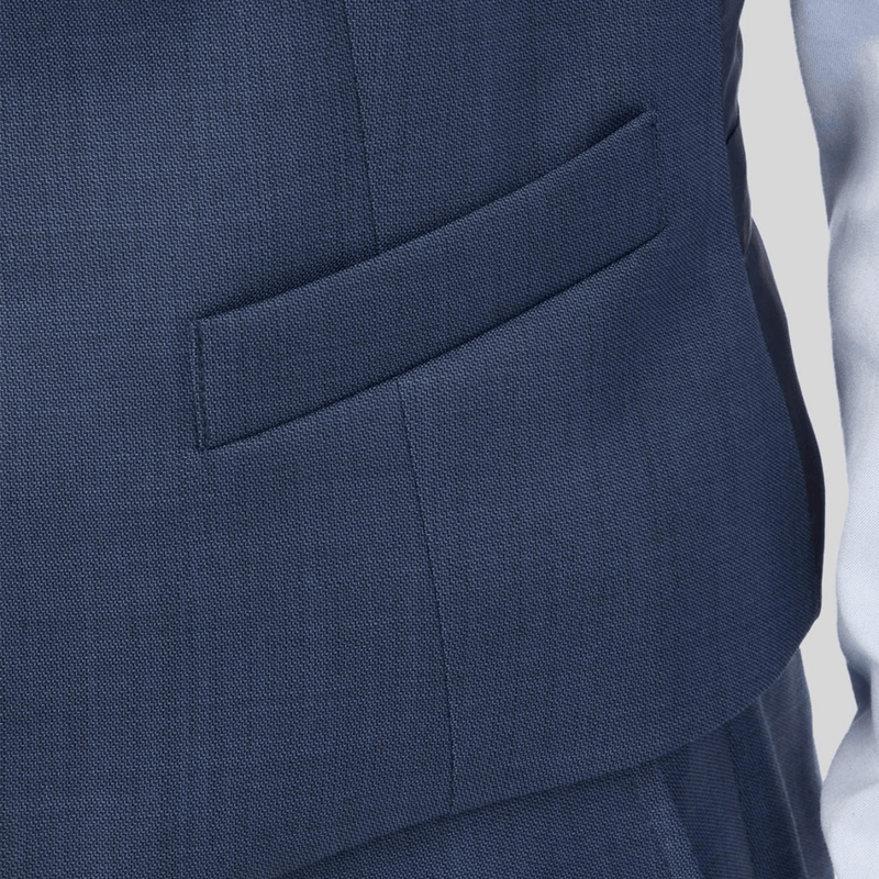 A close up of the mighty vest in blue with front welt pockets 
