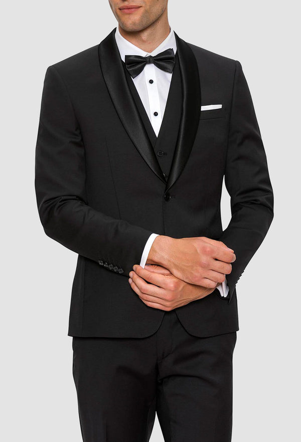 A close view of the satin shawl lapel on the Gibson slim fit spectre evening tuxedo jacket in black pure wool F34087