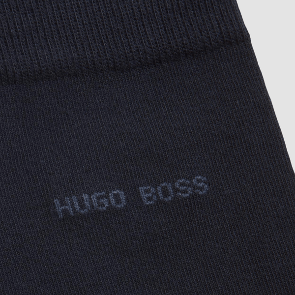 a close up fo the hugo boss logo in capital letters embroisered into the sock