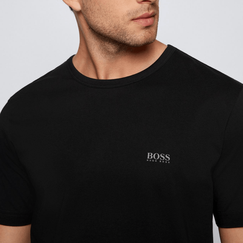 a front close view of the hugo boss classic fit crew neck tshirt in black pure cotton showing the small HUGO hugo boss logo on the left chest