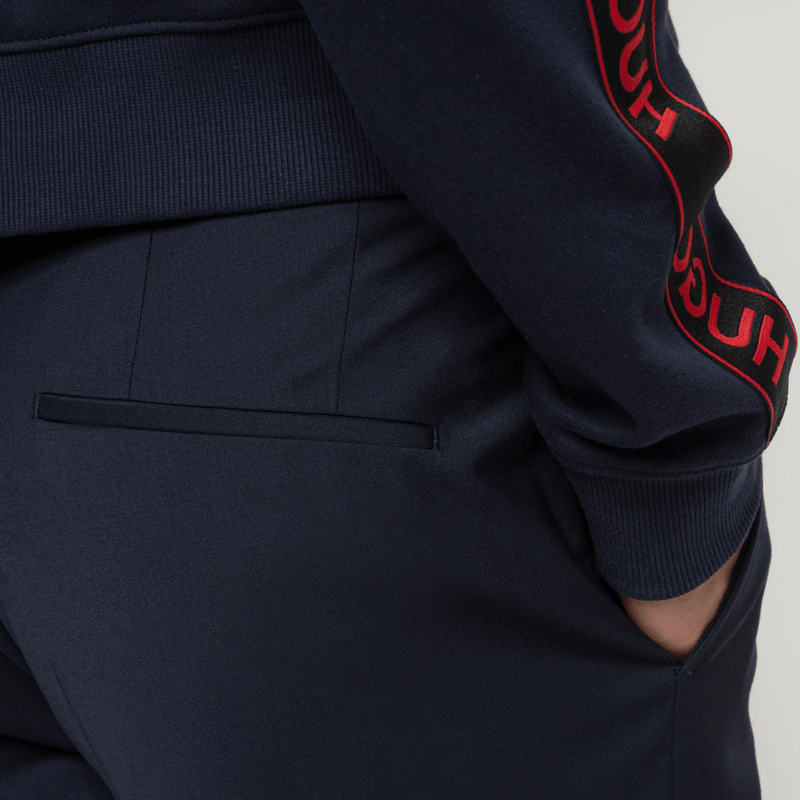 the back and side slant pocket of the hugo getlin trouser in dark navy blue