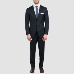 a joe black mens suit on a model with a white shirt underneath and a spotted blue tie