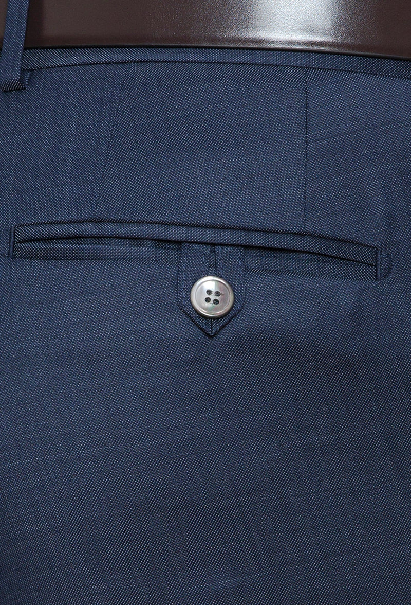 a close up view of the rear hip pocket details on the Joe Black slim fit razor trouser in blue pure wool
