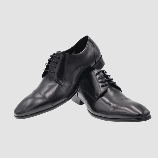a pair of martino carolus mens leather dress shoes in black 