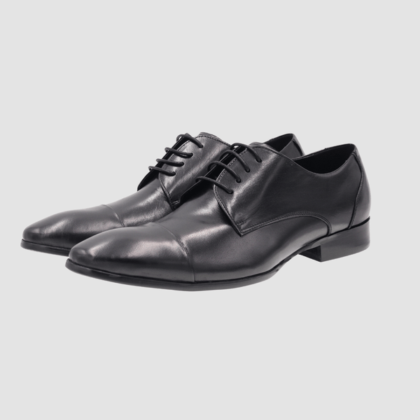a pair of martino carolus mens leather dress shoes in black  with black laces