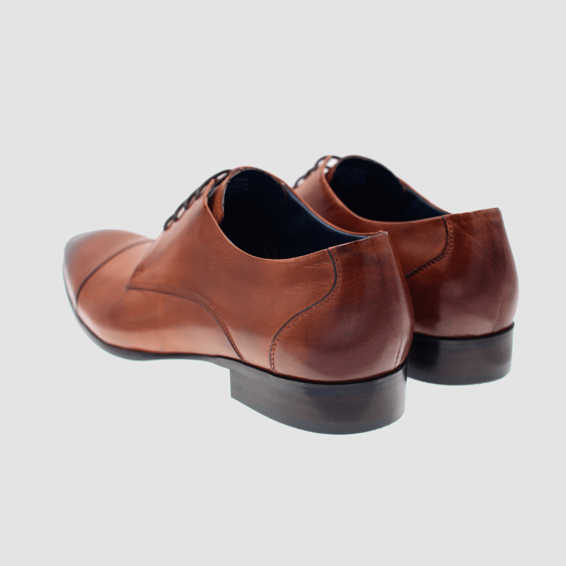the back of the mens leather dress shoe in tan